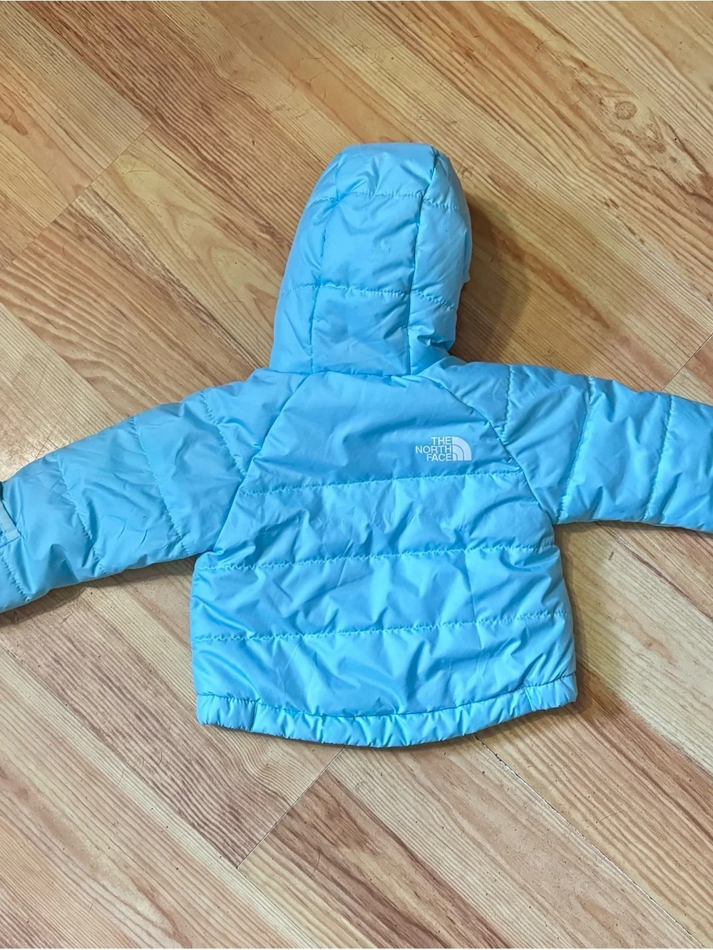 The North Face. Baby coat.  Reversible blue